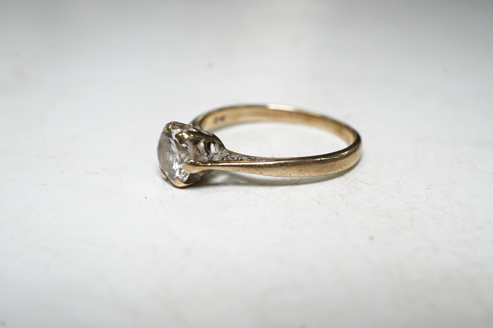 A 9ct gold solitaire diamond ring, size L, 1.8 grams. Condition - fair